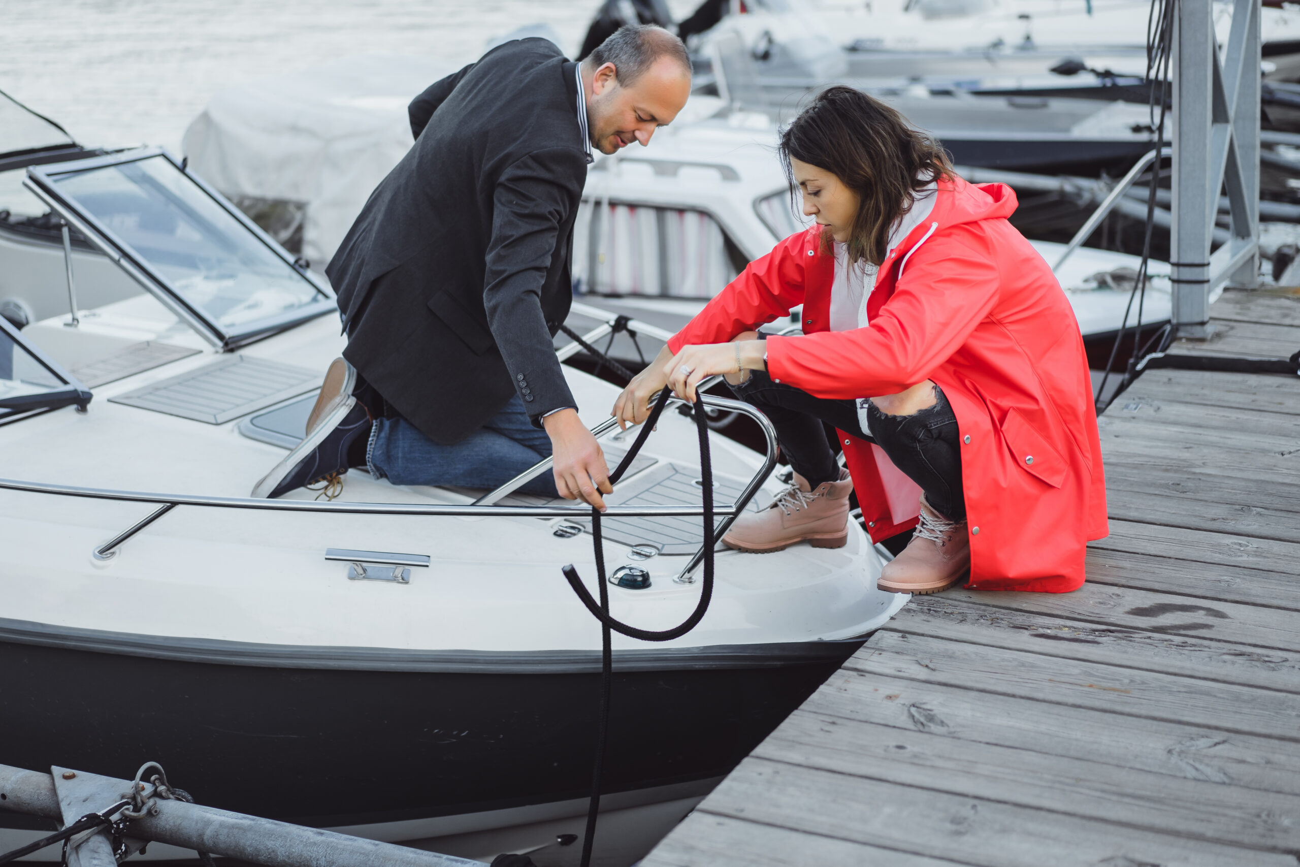 young couple yachting port scaled